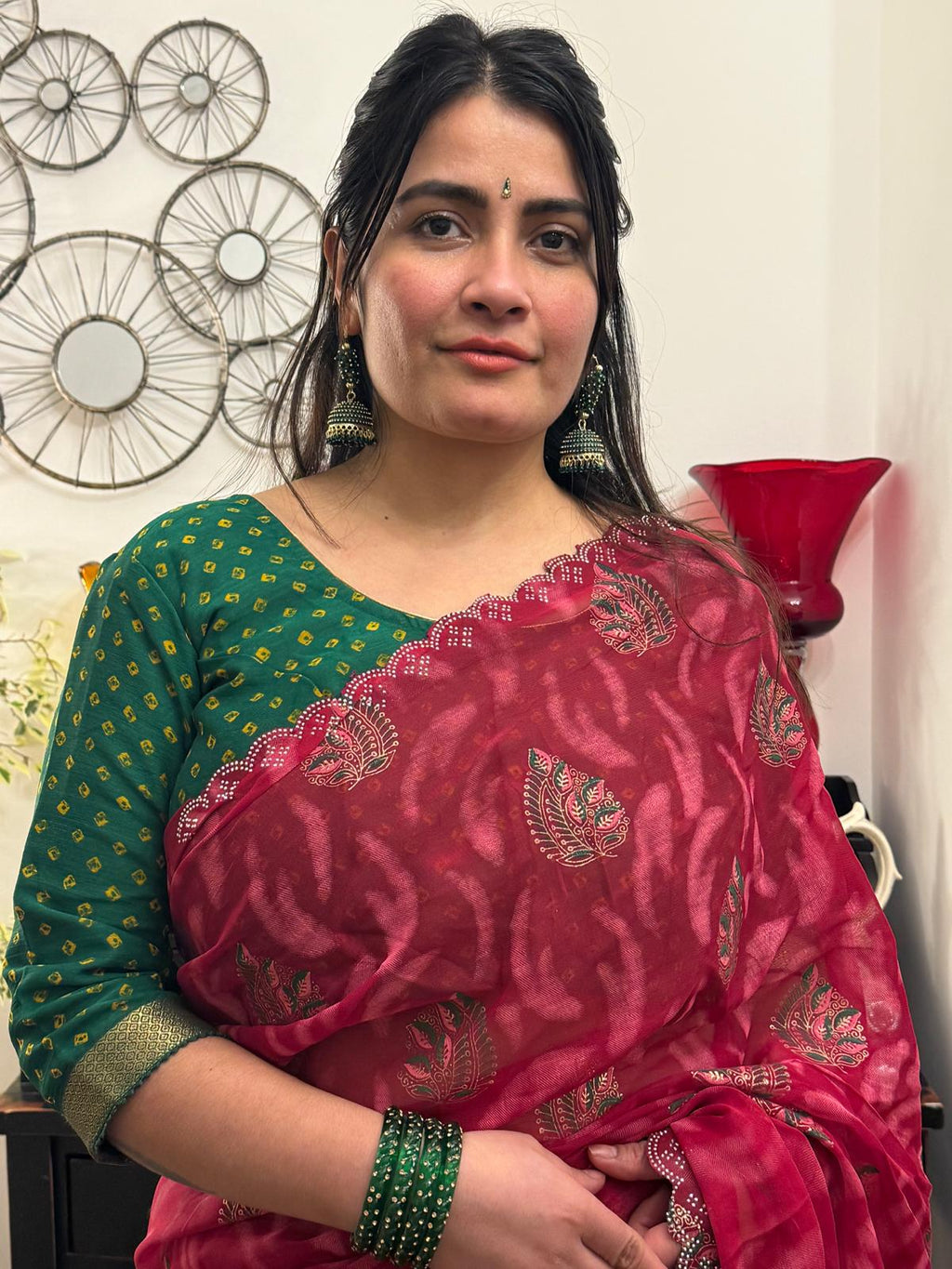 A beautiful cotton saree in a rich raspberry red hue,featuring delicate hand- painted motifs scattered gracefully across the fabric £30