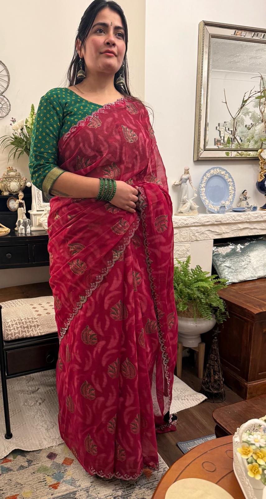 A beautiful cotton saree in a rich raspberry red hue,featuring delicate hand- painted motifs scattered gracefully across the fabric £30