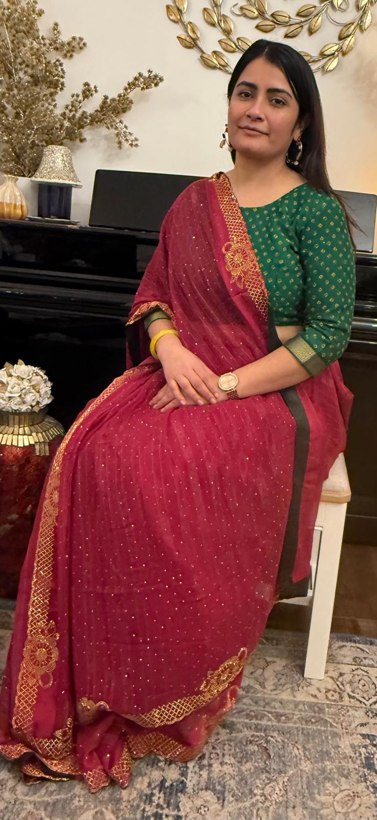 Ruby red chiffon saree with delicate gold stonework.Effortlessly elegant and exquisitely beautiful.It celebrates the devine  grace and timeless beauty of womanhood £60