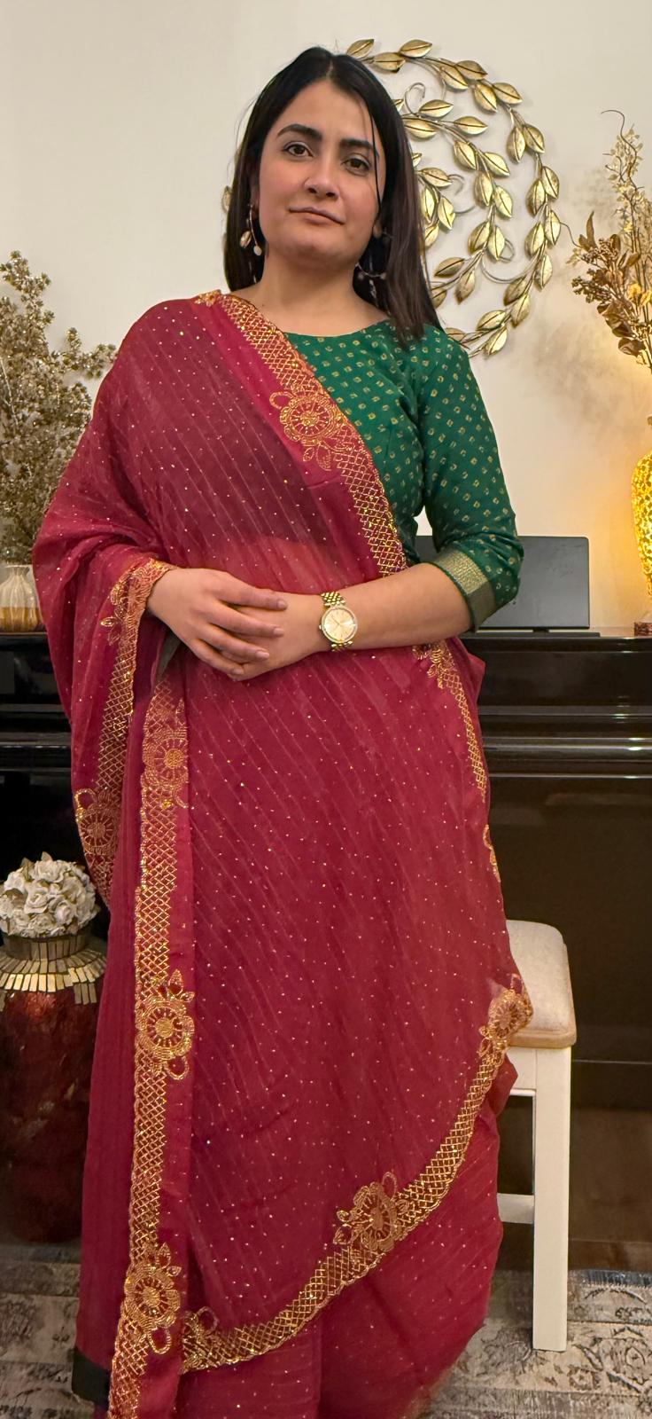 Ruby red chiffon saree with delicate gold stonework.Effortlessly elegant and exquisitely beautiful.It celebrates the devine  grace and timeless beauty of womanhood £60