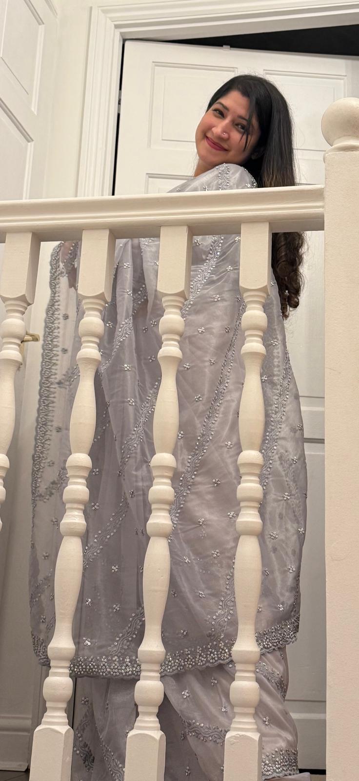 Beautiful light grey saree with embroidery in tissue silk.A colour of balance and calmness £70