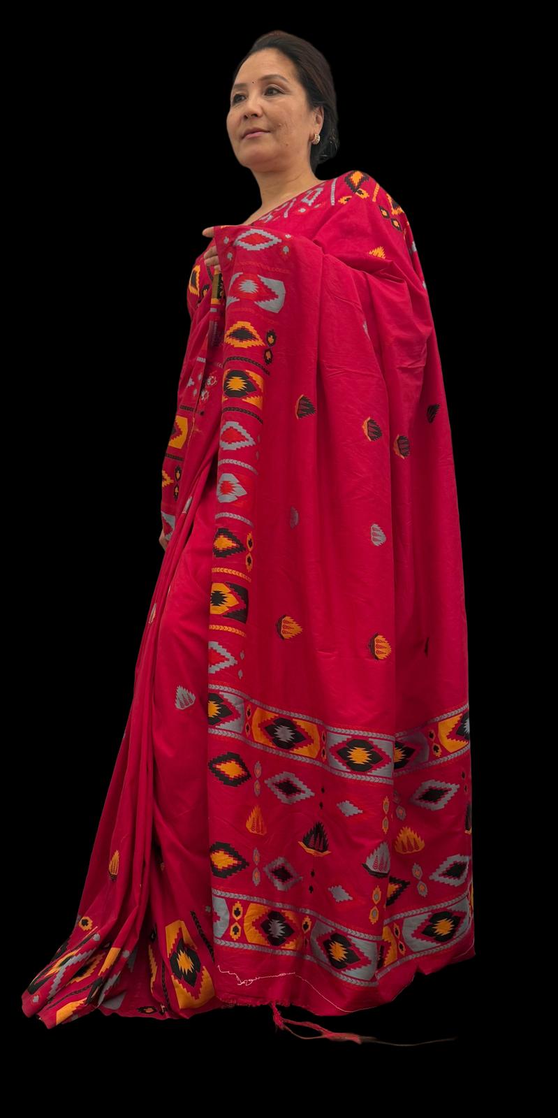 A hot pink raw silk saree featuring subtle geometrical patterns in the traditional Dhaka print, showcasing timeless craftsmanship with a contemporary appeal £70