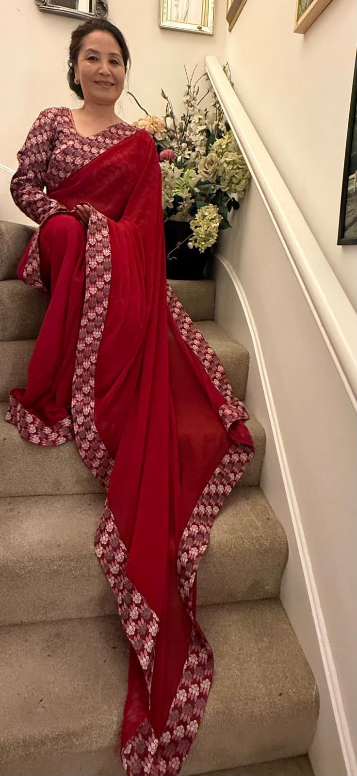 Lipstick red plain Dhaka print saree, beautifully embellished with authentic Nepali Dhaka print work along the border,enhancing its charm and grace. £135