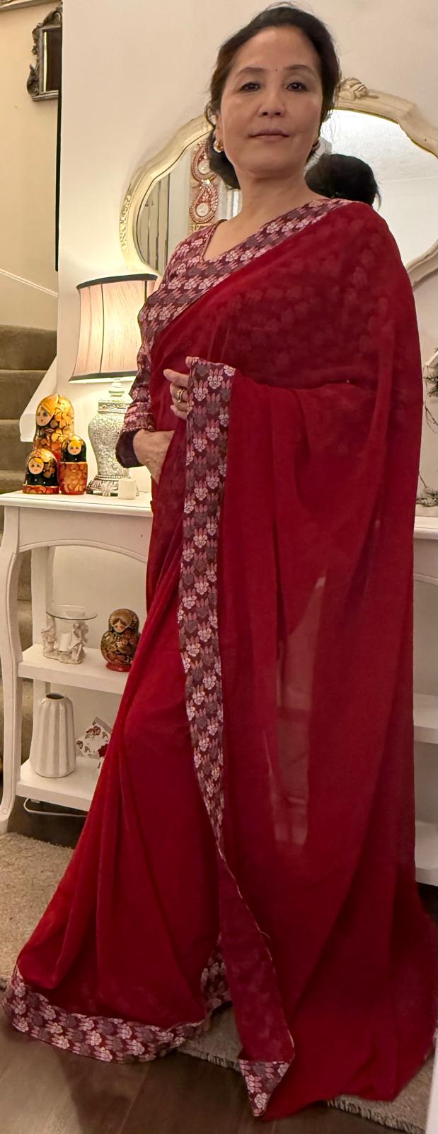 Lipstick red plain Dhaka print saree, beautifully embellished with authentic Nepali Dhaka print work along the border,enhancing its charm and grace. £135