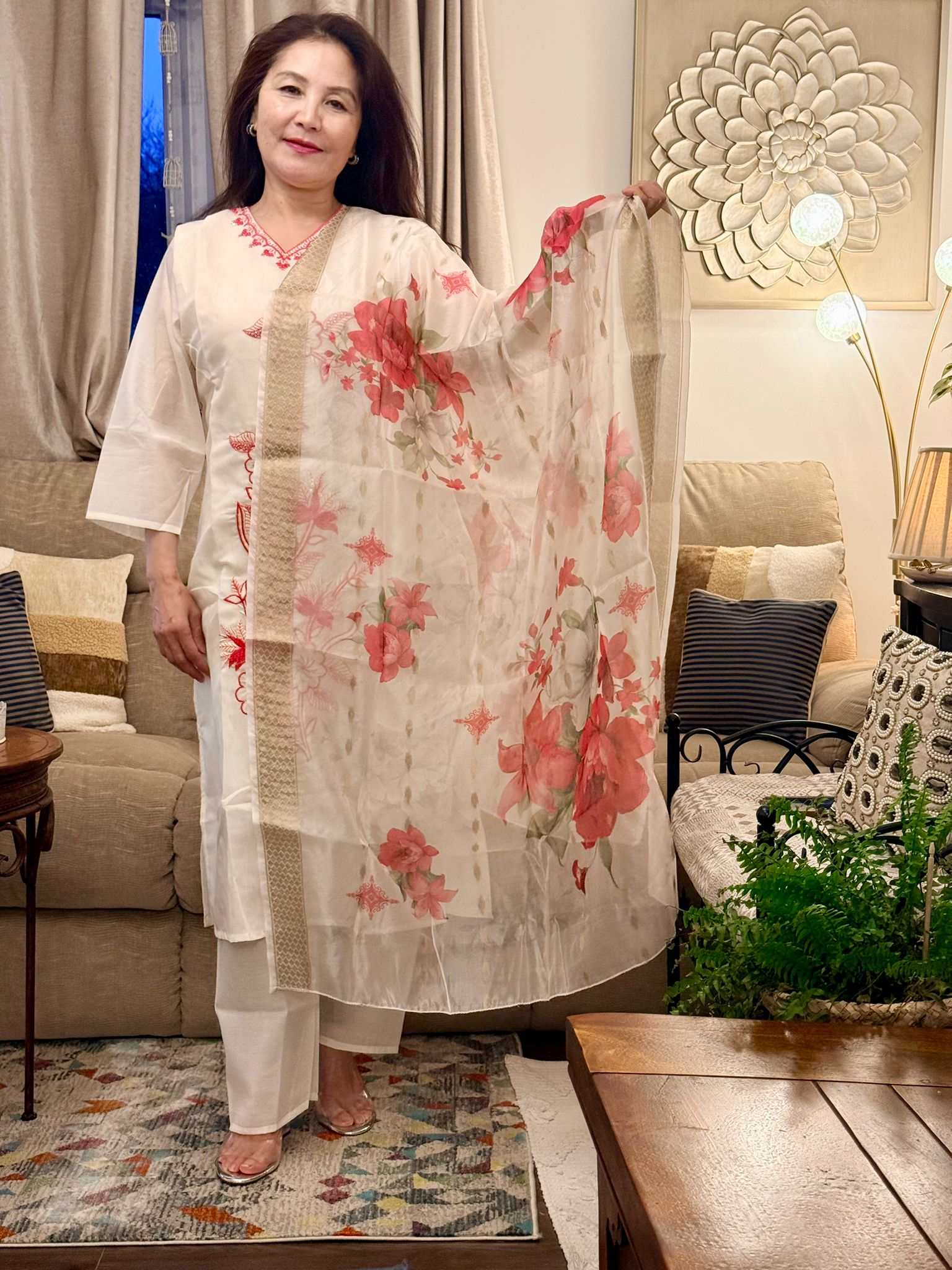 Set against an off-white backdrop,this ensemble is brought to life with radiant lipstick red embroidery and delicate floral patterns. £30