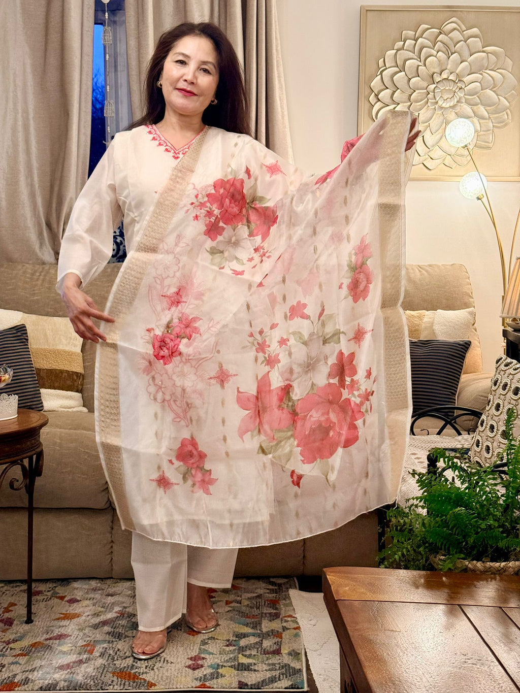 Set against an off-white backdrop,this ensemble is brought to life with radiant lipstick red embroidery and delicate floral patterns. £30