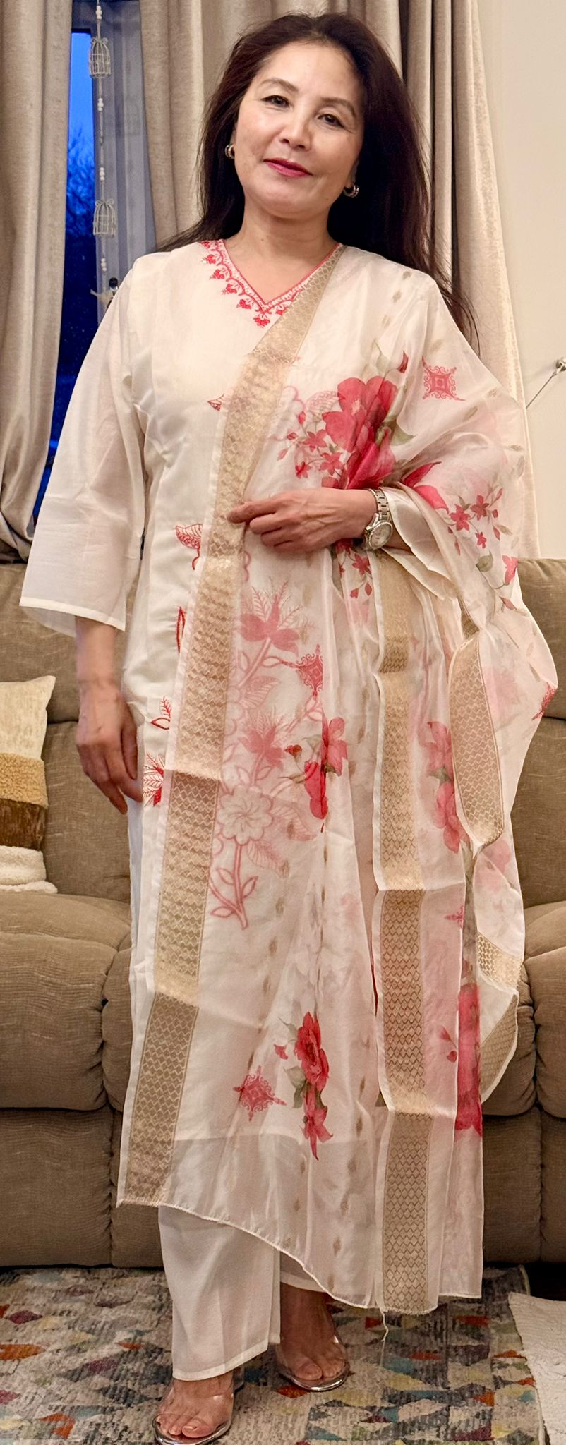 Set against an off-white backdrop,this ensemble is brought to life with radiant lipstick red embroidery and delicate floral patterns. £30