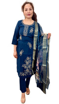 A striking Dodgers blue suit, beautifully adorned with delicate gold detailing that adds a touch of understated luxury.Paired with a coordinating floral print shawl. £30