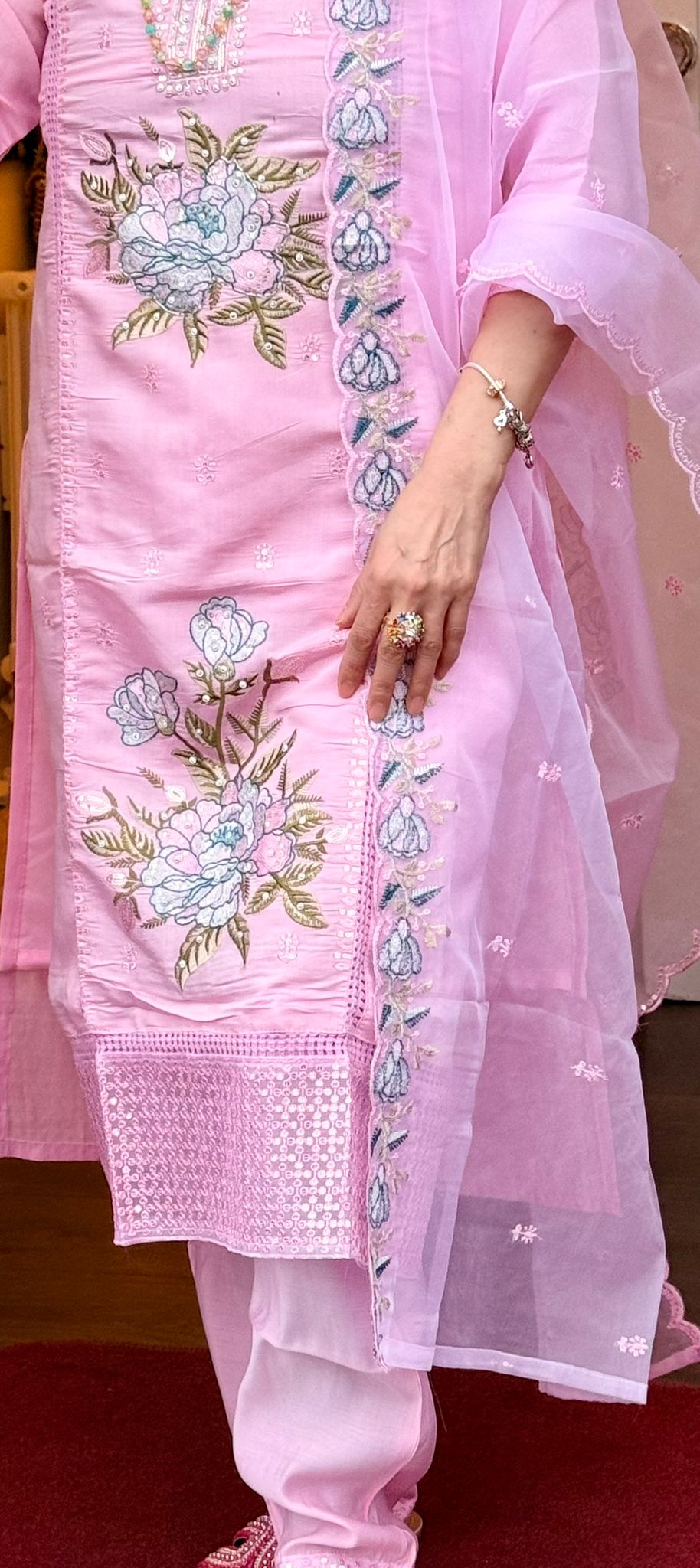 Crafted in rich blush pink silk and detailed with exquisite embroidery, this ensemble represents refined sophistication. The lightweight tissue shawl enhances the look with its delicate shine,creating a harmonious blend of elegance and feminine grace. £45