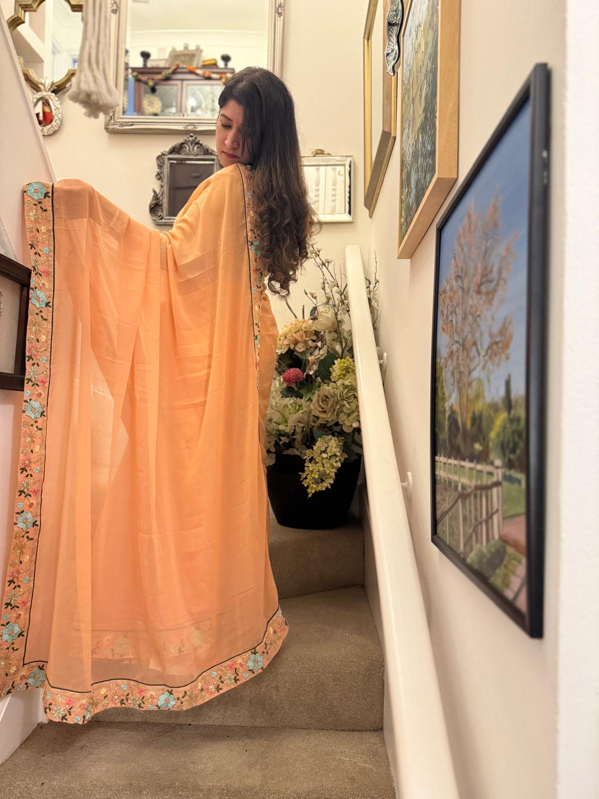 Peach satin ciffon, with embroidered border £55
