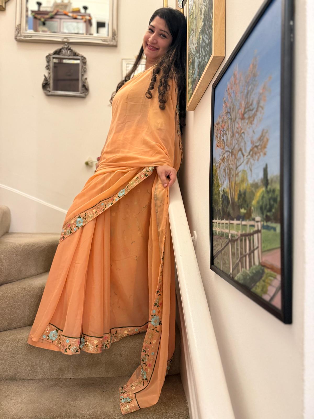 Peach satin ciffon, with embroidered border £55