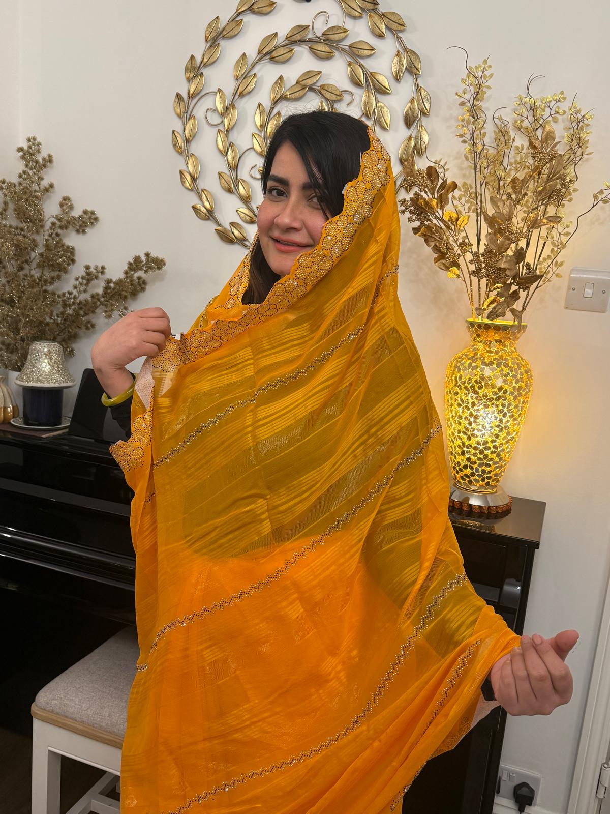 A Saree with soft chiffon drenched in mango - turmeric hues £45