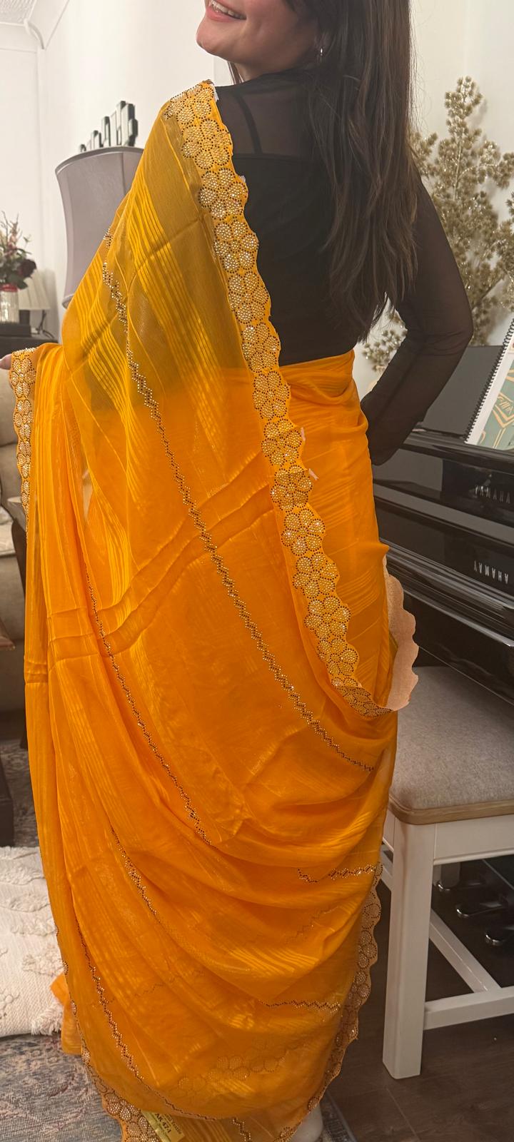 A Saree with soft chiffon drenched in mango - turmeric hues £45