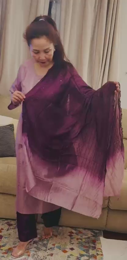 A graceful silk suit in a beautiful blend of soft heather and rich cheery tones. £50
